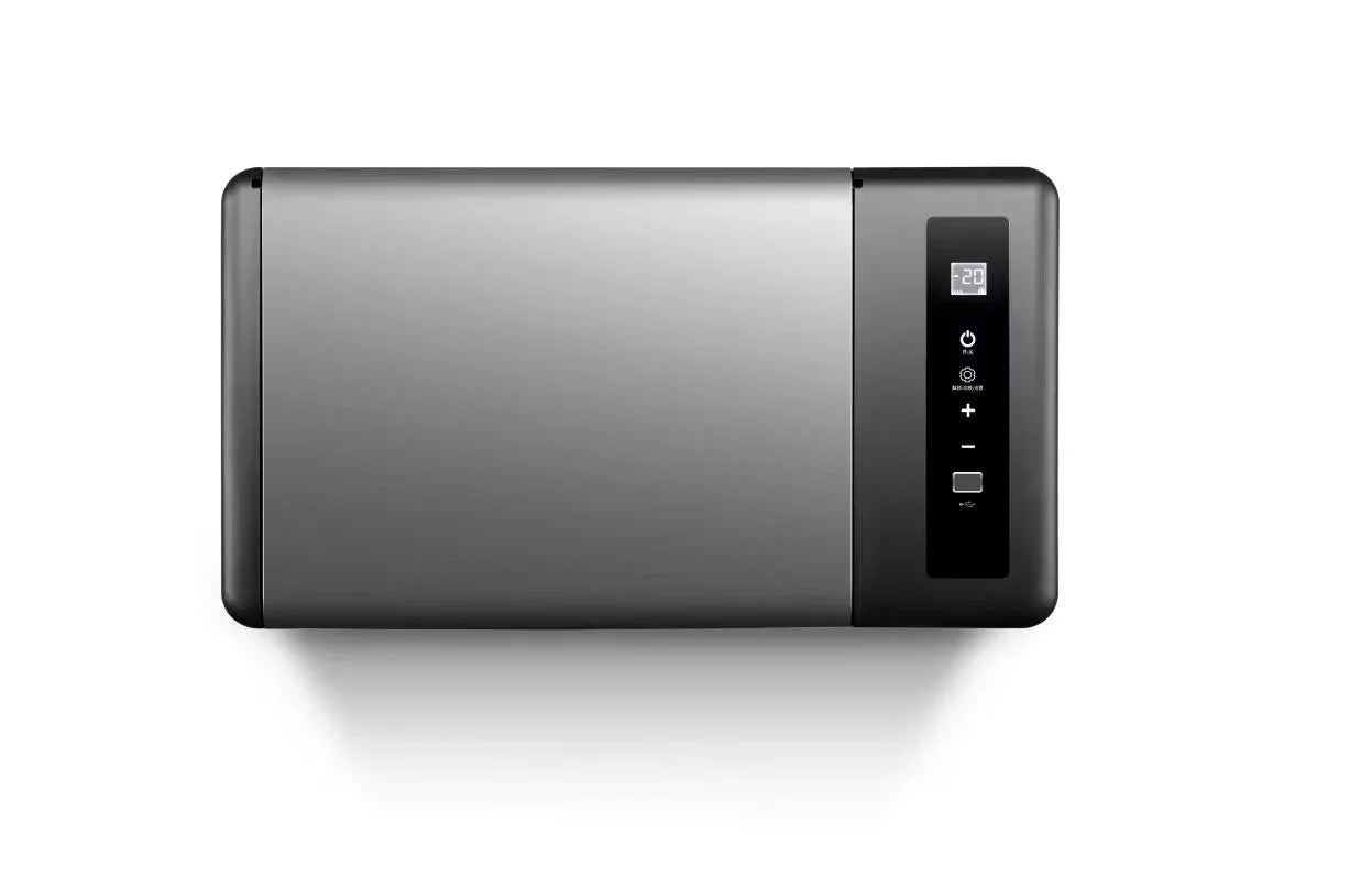 Modern portable fridge freezer with digital control panel on a white background